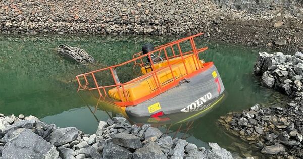 Worker swims to safety from sinking excavator